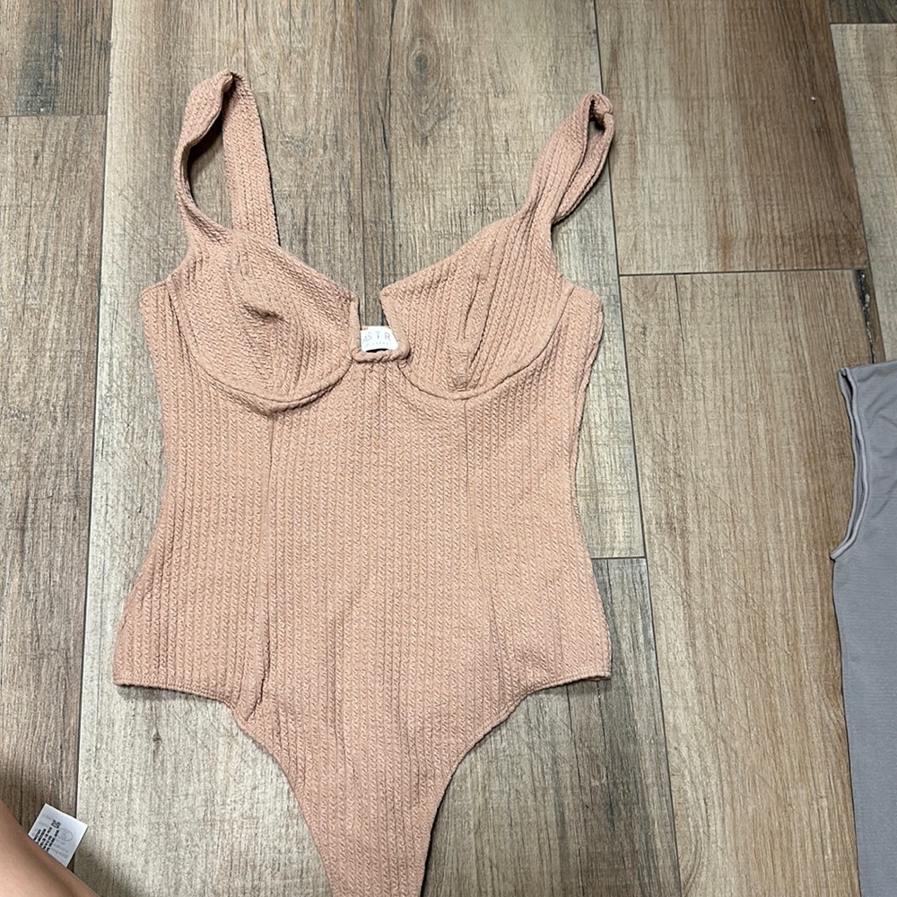 Brand new NEVER WORN ASTR bodysuit